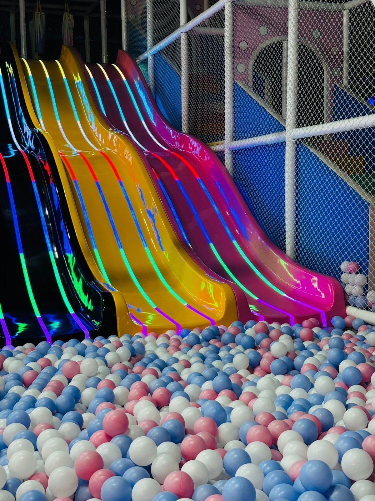 The bright slides above the ball pit at Little Town.
